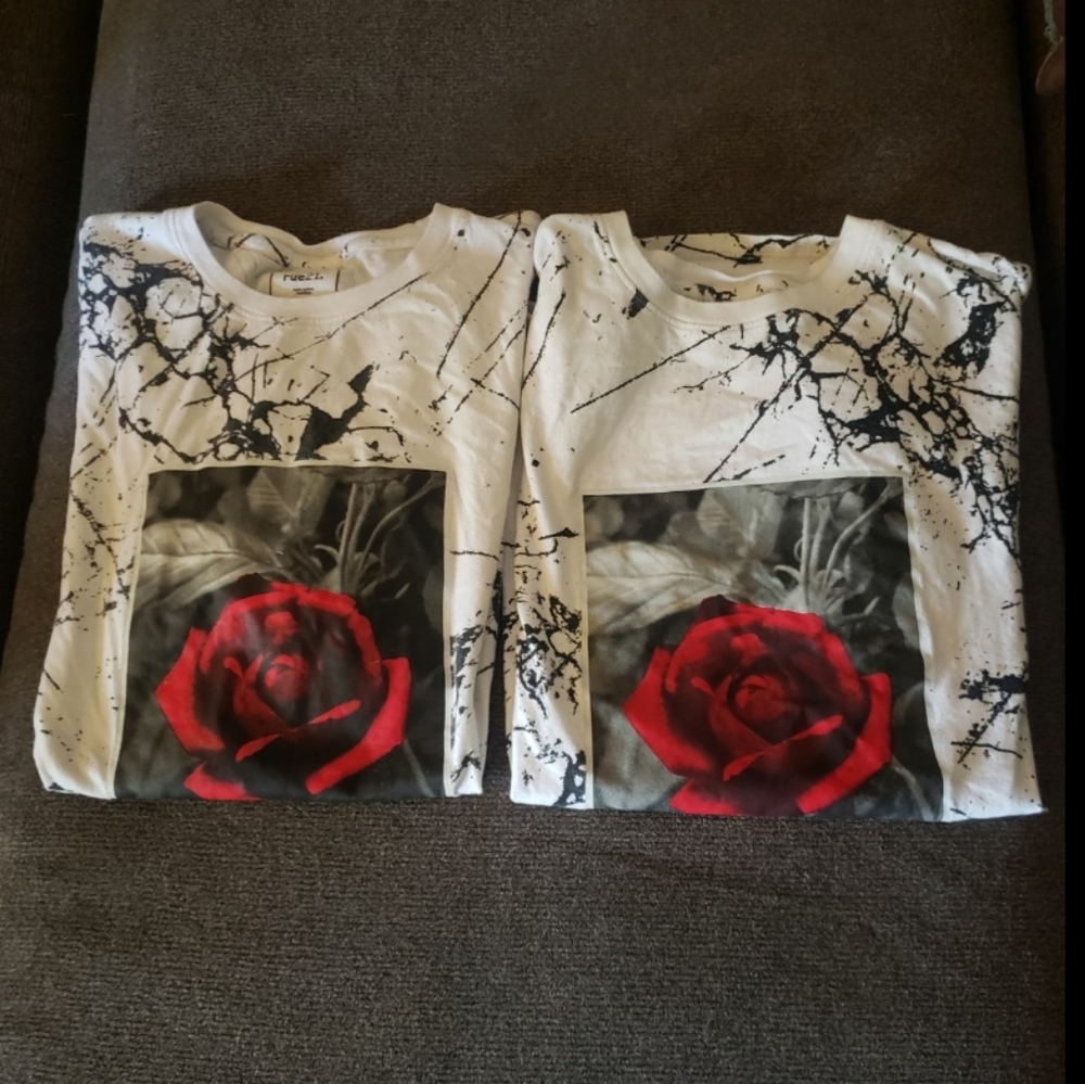 2 White rue 21 T shirts with black splatter and a rose photo on the front.